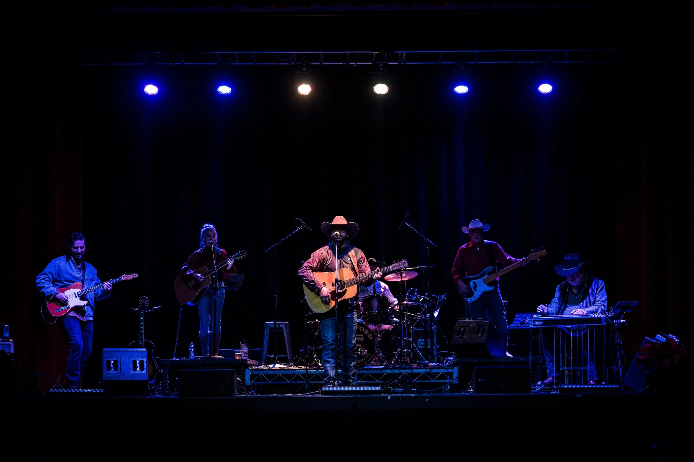 Wide view of the band and the stage lighting