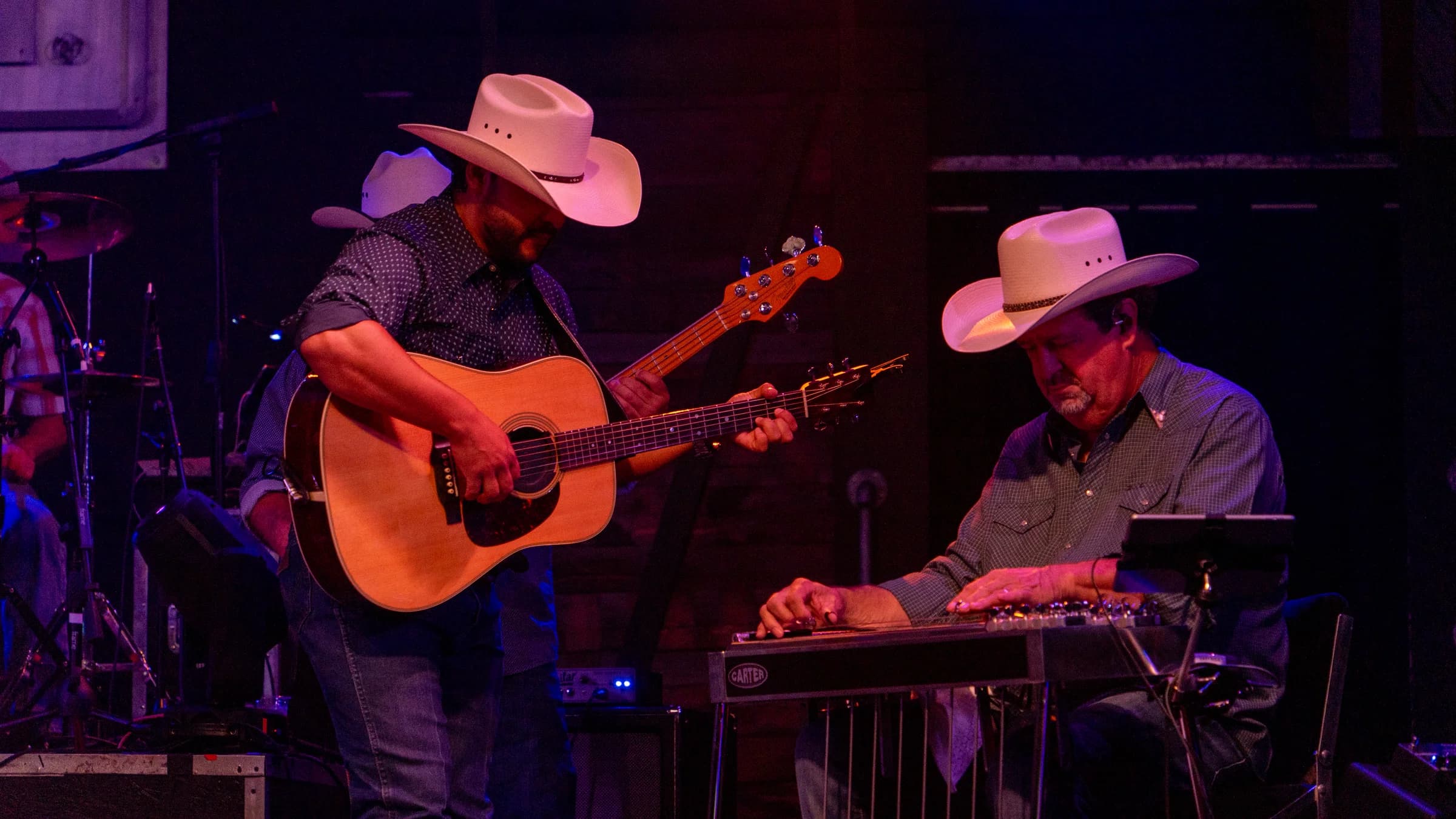 Buck Ford and a guitarist performing together on stage